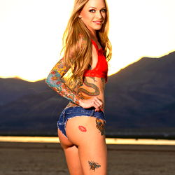 Female Model In Red Tank Top and Jeans