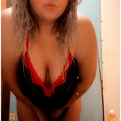 Brittany, an OnlyFans model in a seductive red lingerie