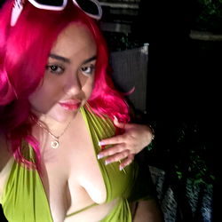 BrillaRo$a, an OnlyFans Model in a Neon Green Dress