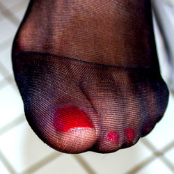 Intimate Foot Display with Red Toes