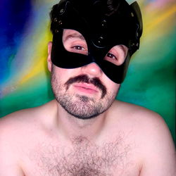 Shirtless Man in Masked Costume