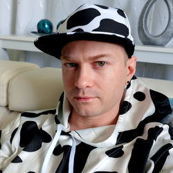 Model in Cows Print Jacket and Cap
