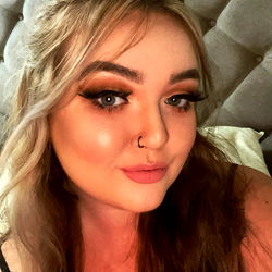 Blonde-haired beauty, Alex, with striking makeup and casual outfit