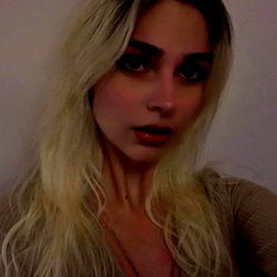 Stylish Blonde Woman with Red Lipstick and Necklace