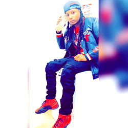 Model Flippa Sitting in Kitchen with Money and Phone