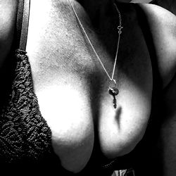 LowKeyCouple's OnlyFans Model Showcasing Her Enhanced Breasts and Tattoos