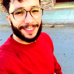 Casually Dressed Man Taking a Selfie Outdoors