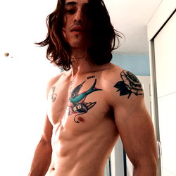 Fitness Model Angel Yazel from Valle Oriente Showcasing Abs and Tattoo