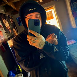 Model with tattoos showcasing his body ink