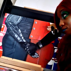 Artist Displaying Superhero-Themed Art