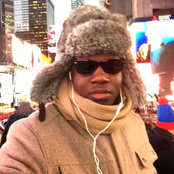 Man in Fur Coat and Sunglasses, Listening to Music on Street