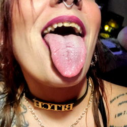 Model Showcasing Tattoos, Piercings and Colorful Makeup