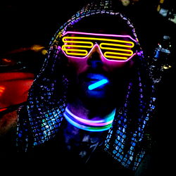 Neon-Fashioned DJ in the Dark