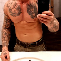 OnlyFans Model Taking a Mirror Selfie in Gym