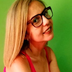 Chic Woman in Pink Blouse and Glasses