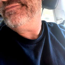 Soulful Portrait of a Bearded Man in a Car