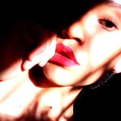 A woman with a vibrant red lipstick