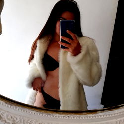 Model in Onlyfans Apparel Taking Selfie