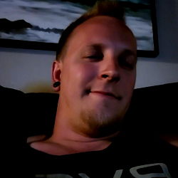 Young Adult Male with Tattoos and Shaved Head