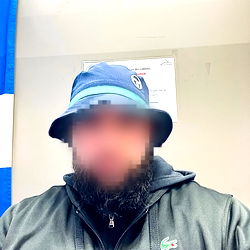 Anonymous Person in Hat and Jacket