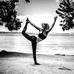 A Fitness Model's Yoga Practice on the Beach