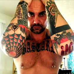 Tattooed Man with Piercings