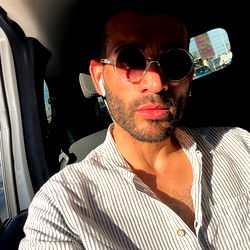 Alex, a model from Lisboa, captures the moment on a sunny day.