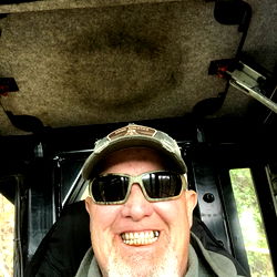 Bearded Man in Truck with Sunglasses