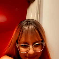 Female Adult with Red Hair and Glasses