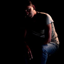 Intense Portrait of Anghelo Fernandez from Ecuador, Sitting in Silhouette