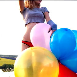 Vibrant and Playful: ARYX Looner FREE Amidst a Rainbow of Balloons