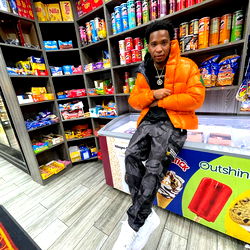 Rob Gotti poses confidently in convenience store