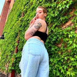 Fashion-forward model posing confidently against a backdrop