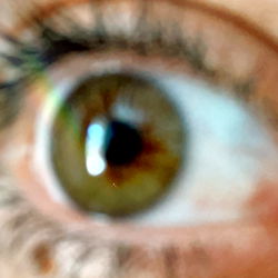 Blurred Close-up of an Eye and a Portion of a Face