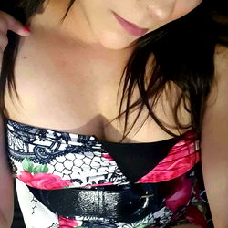 A captivating pose in a floral swimsuit