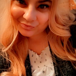 Blonde Woman Smiling at the Camera