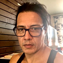 Man with Tattoo and Glasses