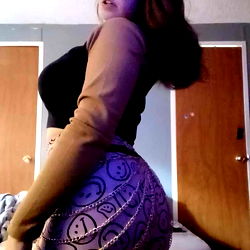 Sam, a 23-year-old model, flaunts her unique style in the bedroom