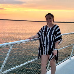 Beautiful Ms. Mango, standing proudly on a boat at sunset, Iowa