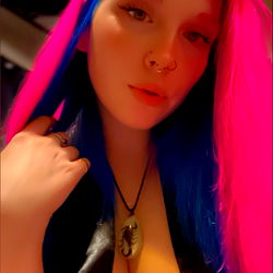 Alora, the vibrant model with pink hair