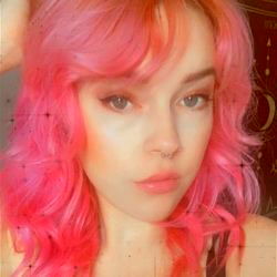 Vividly Styled Model with Pink Hair and Colorful Makeup