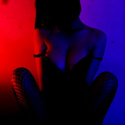 Aesthetic Goth Model with Red Light Ambiance