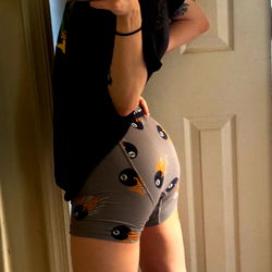 Stylish and playful OnlyFans model Jo Azumaya strikes a pose in her bedroom mirror, showcasing her unique fashion sense and gym-toned physique.