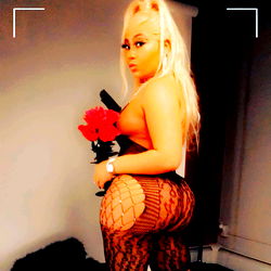 Schmoney Doll, OnlyFans Model Posing with Red Rose