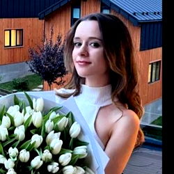 Model Posing with Bouquet of Flowers