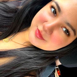 Lala, the captivating Onlyfans model posing for a photo in her car