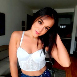 OnlyFans Model Natalie Poses in a White Tank Top