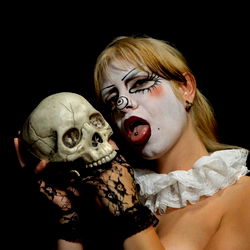 Felix the Clown, holding a skull