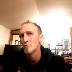 Nicholas Weller, a man with a beard in a home environment