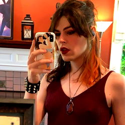 Female Model in Red Shirt Taking Selfie